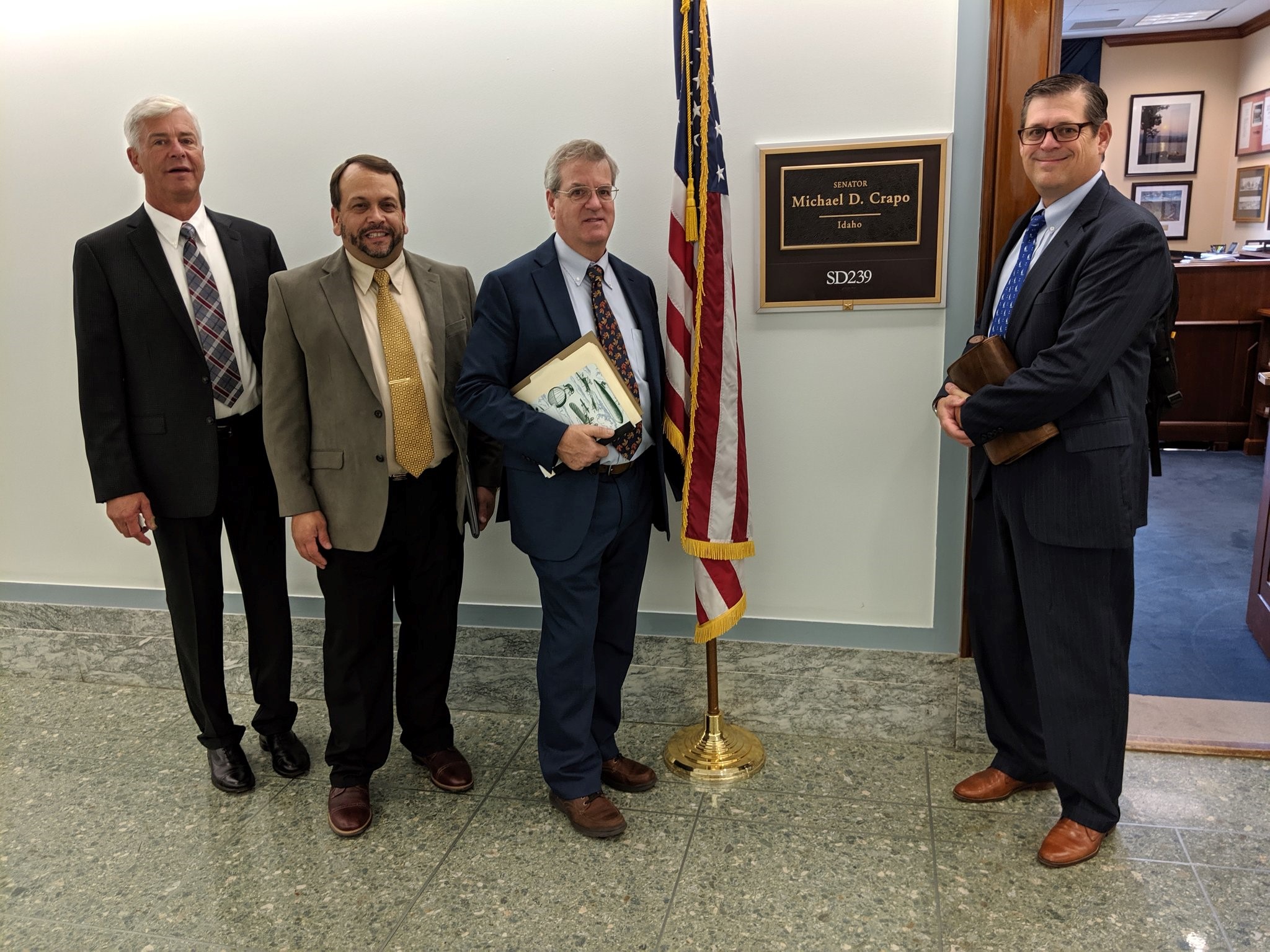 Photo of Stan Elliot, Pacific Coast Pellets; Charlie Niebling, Innovative Natural Resource Solutions; John Utter, Lignetics; and Stephen Faehner, American Wood Fibers, ready to meet with Idaho Sen. Mike Crapo at the PFI’s Washington, D.C., fly-in. 